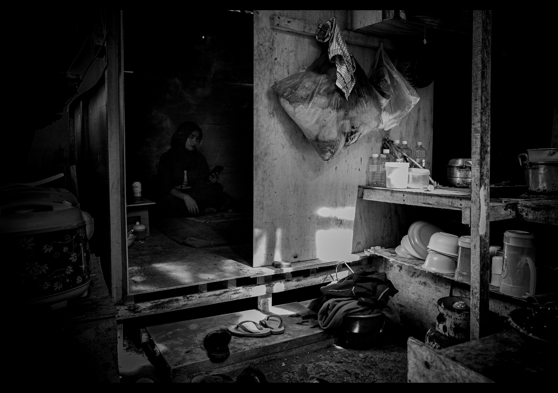 Steel pipes and construction materials piled in darkness on a Canggu building site