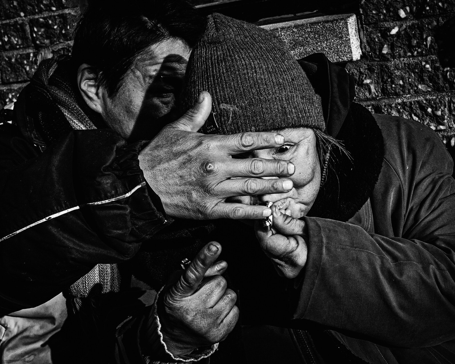 Bob shields Mary's face with his hand as she lights a cigarette — Looking for Mary